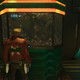 Star-Lord talking to a large alien squished inside of a small glass box on a space station.